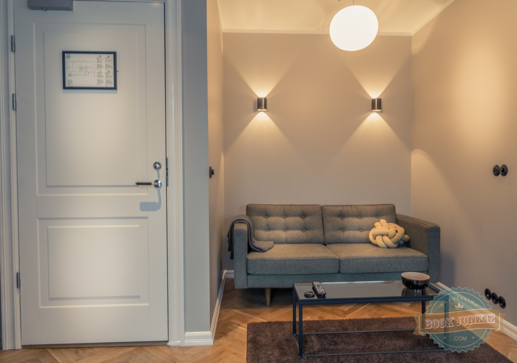 Cornflower blue sofa in apartment in Kvosin Downtown Hotel in Iceland