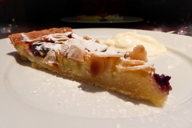 Plum tart and clotted cream dessert at the apex off the wall restaurant in London