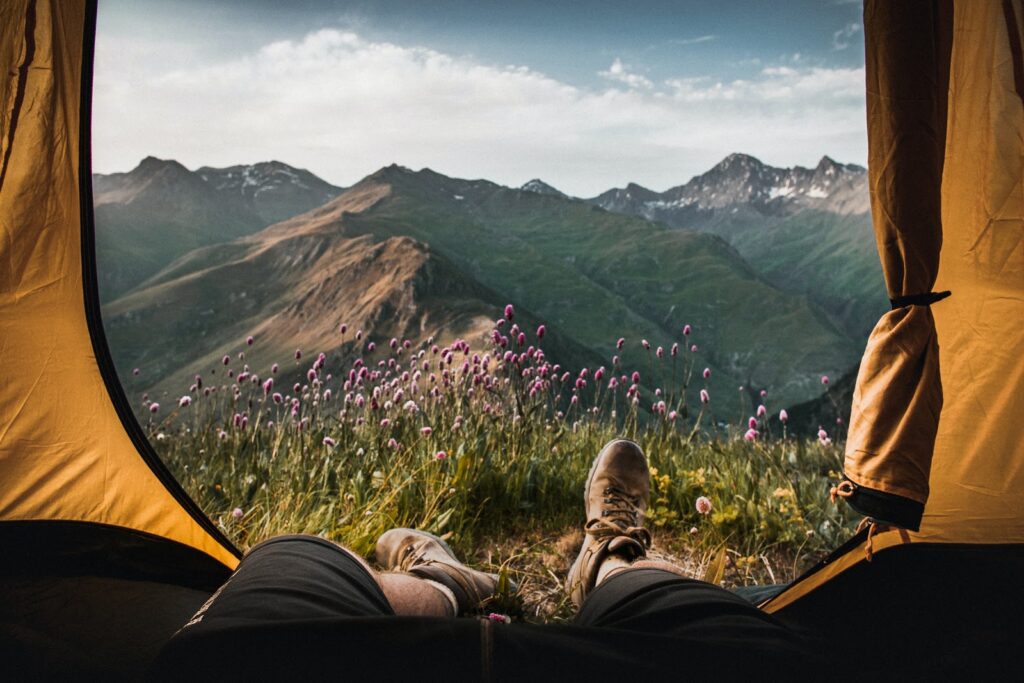 Stunning mountain views from the opening of a tent.