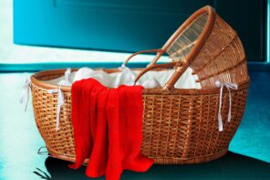 The Perfect Mother book cover with a baby wicket basket and a red blanket on a blue background